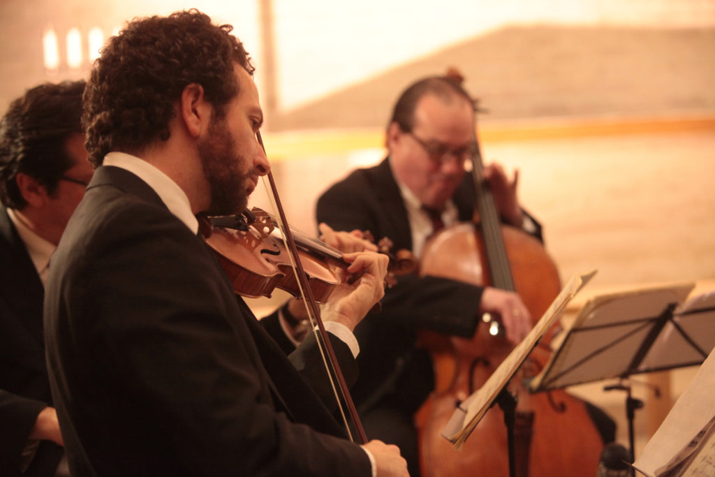members of accordo playing a chamber concert